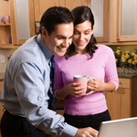 Business couple looking at laptop.